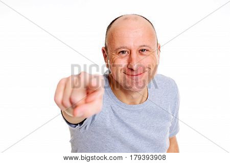 Baldheaded Man Pointing In To The Camera And Smiling
