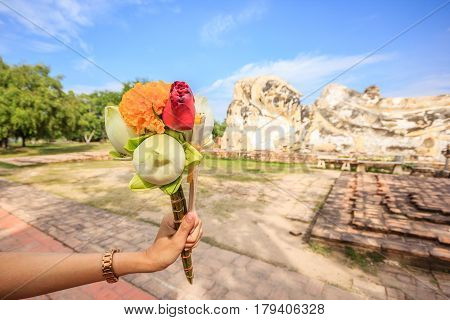 Lotus for pray to Lying Buddha statue at Wat Lokayasutharam in Ayutthaya Historical Park Ayutthaya Thailand