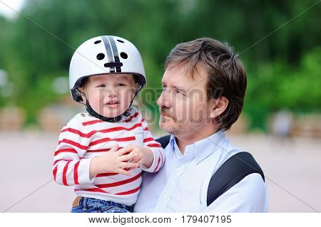 Crying Toddler Boy And His Father Outdoors