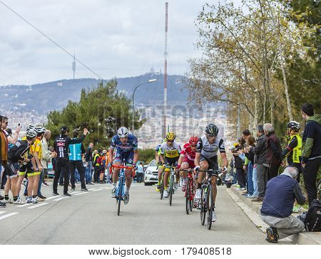 Barcelona Spain - March27 2016: Group of cyclists riding on the road to the top of Montjuic in Bracelona Spain during Volta Ciclista a Catalunya on March 27 2016.