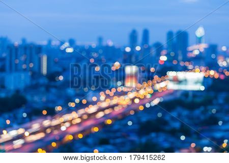 Twilight blurred bokeh aerial view city and highway road night view abstract background