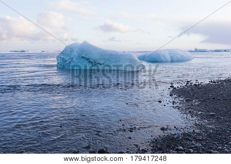 Black sand beach and Ice breaking from iceberg Iceland winter season natural landscape background