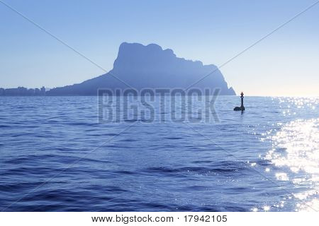 Ifach Penon mountain from Calpe fog backlight floating beacon