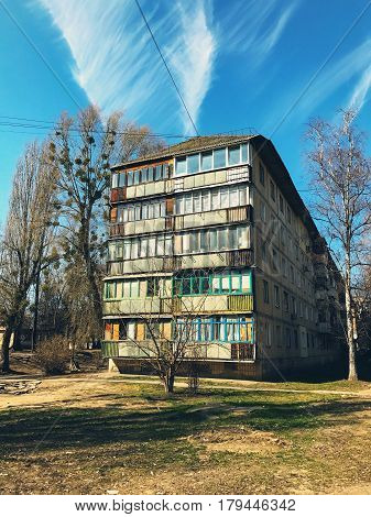 Old building with color bright windows in rural area