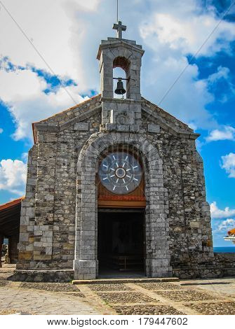 Gastelugache - island on coast of Bay of Biscay belonging to municipality of Bermeo Basque Country. Island is connected to mainland by man-made bridge that goes into winding staircase that spans 237 degrees.