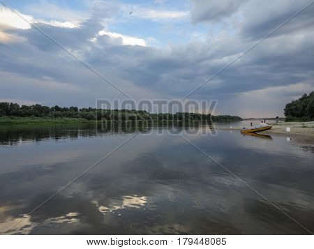 Panoramic view along Ahtuba river with clouds reflections on the water surface, Russia