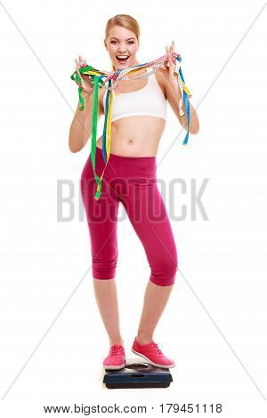 Happy Woman With Tape Measures On Weighing Scale.