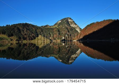 Quiet morning at lake Wagital Swiss Alps. Autumn day.