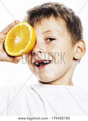 little cute boy with orange fruit double isolated on white smiling without front teeth adorable kid cheerful close up