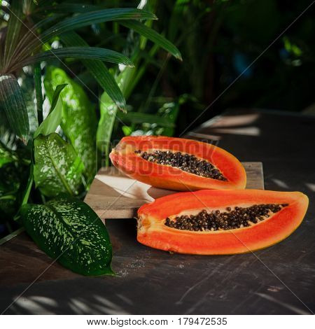 Fresh Ripe Tropical Fruit: Orange Papaya On Green Nature Background