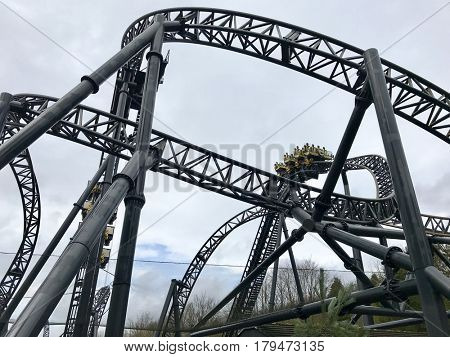 ALTON TOWERS - MARCH 30, 2017: The Smiler steel roller coaster at Alton Towers Resort in Staffordshire, England, UK. The ride features 14 inversions.