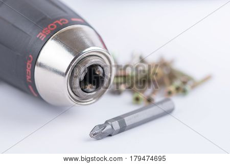 Head Of Acu Drill On The White Background With Screws