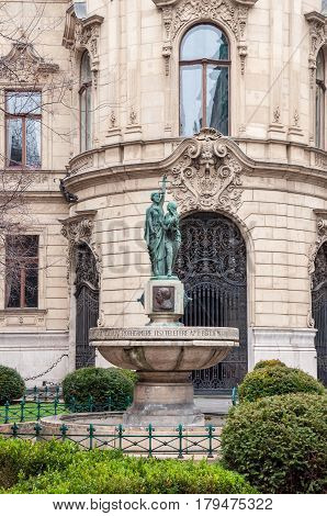 Fountain on the background the facade of Metropolitan Ervin Szabo Library is the largest library network in Budapest Hungary.