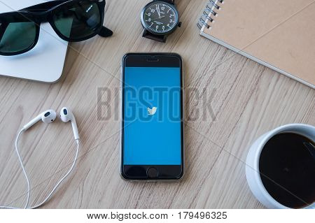 CHIANG MAI THAILAND - JAN 28 2016: Person holding a brand new Apple iPhone with Twitter logo on the screen. Twitter is a social media online service for microblogging and networking communication.