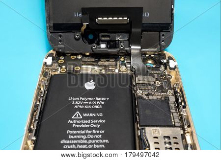 Chiangrai Thailand: March 14 2017 - Apple iPhone disassembled for repair and showing components inside. Selective focus