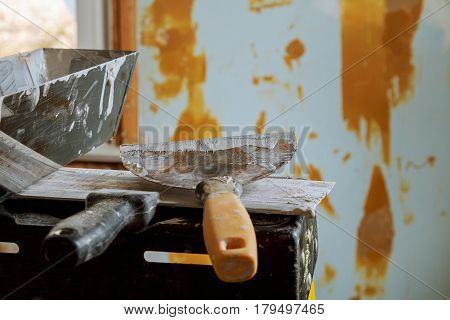 Repair broken walls with plaster putty. wall broken trowel for plastering
