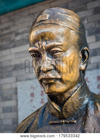Tianjin, China - Nov 1, 2016: Bronze portrait figure of scholar Yan Fu at the Tianjin Ancient Cultural Street (Guwenhua Jie). He introduced many Western ideas to China.