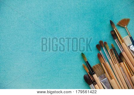 Lots Of Paintbrushes On Colorful Canvas Background