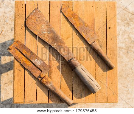 Rusty Knifes On Wooden Tiles, Farmer Equipment In Thailand