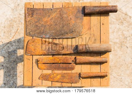 Rusty Knifes On Wooden Tiles, Farmer Equipment In Thailand