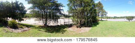 GOLD COAST, QUEENSLAND, AUSTRALIA - MARCH 31ST: Flood waters Panorama at the Coomera River Weir on 31st March at Oxenford 