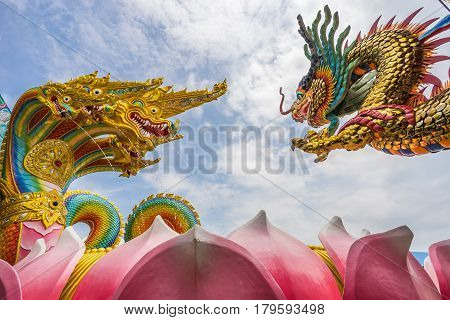 Chinese dragon with Thai King of naga in Buddhist temple