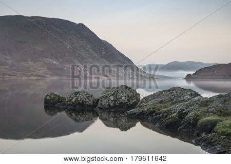 Stunning Winter Foggy Sunrise On Crummock Water In Lake District England