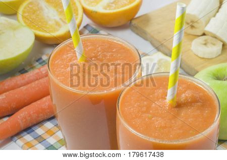 Fruit mix of carrots, apples, oranges, lemon and banana