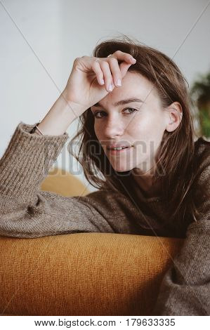 indoor portrait of beautiful feminine thoughtful young women alone in the room.
