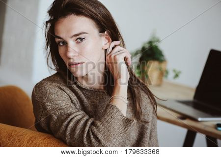 indoor portrait of beautiful feminine thoughtful young women alone in the room.