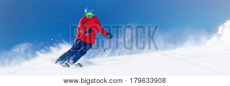 Man Skiing On The Prepared Slope With Fresh New Powder Snow In Alps