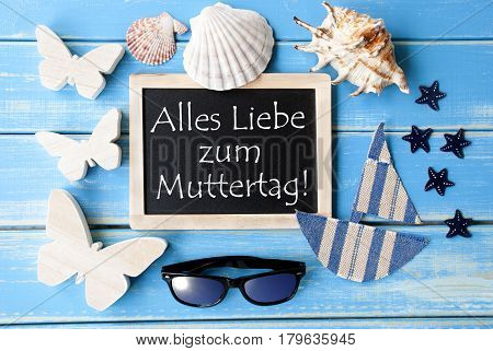 Flat Lay Of Chalkboard On Blue Wooden Background. Nautical Summer Decoration As Holiday Greeting Card. German Text Alles Liebe Zum Muttertag Means Happy Mothers Day