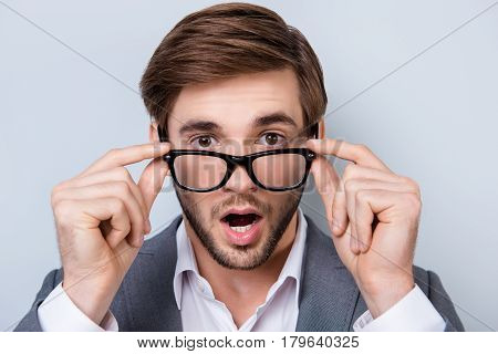 Close-up Portrait Of Amased Surprised Handsome Young Man With Bristle In Formal Wear In Shock And Ho