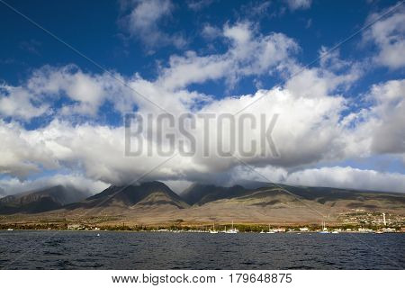 Sea surface with waves and beautiful heavenly landscape with clouds and sunny sky