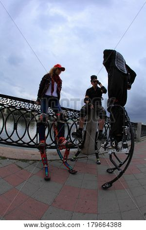 Ekaterinburg Russia August 20 2011. The celebration of city day. A group of young people on spring stilts.
