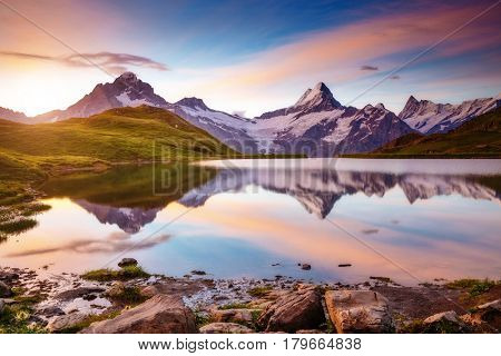 Captivating scene of the snow rocky massif. Gorgeous dawn. Location place Bachalpsee in Swiss alps, Grindelwald, Bernese Oberland, Europe. Wonderful image of wallpaper. Explore the world's beauty.