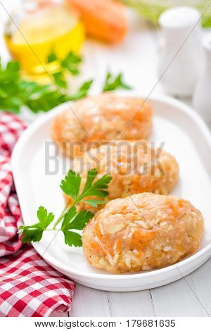 Raw uncooked meat cutlets with vegetables baby food