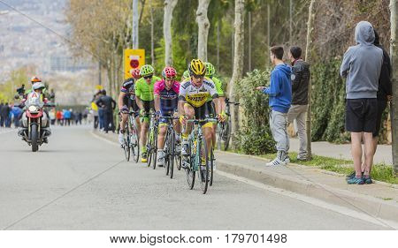 Barcelona Spain - March27 2016: Group of cyclists riding on the road to the top of Montjuic in Bracelona Spain during Volta Ciclista a Catalunya on March 27 2016.