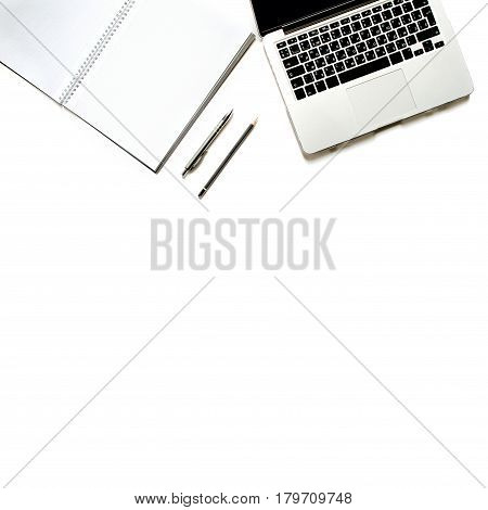 Modern minimalistic work place. White office desk table with laptop keyboard, pen. Top view with copy space, flat lay