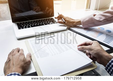 Team Work Process. Young Business Managers Crew Working With New Startup Project. Labtop On Wood Tab