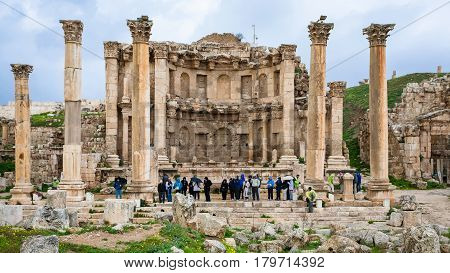 Tourists Near Nymphaeum In Geraca Town In Winter