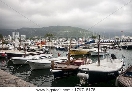 Yachts at the sea mooring in the background of the mountains