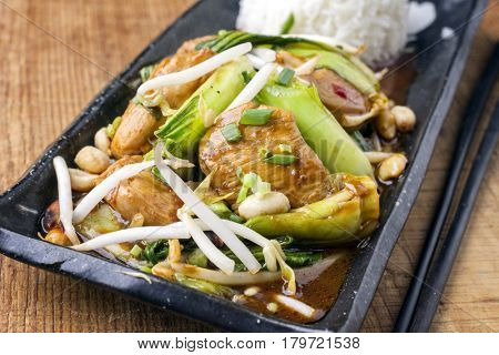 Traditional Chicken Gung Bao with Vegetable as close-up on a plate