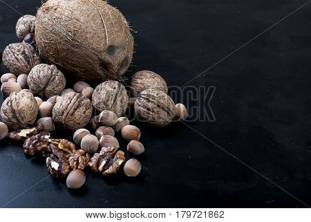 Assorted Nuts On A Black Background