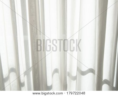 White transparent curtains. Morning ligth and shadows.