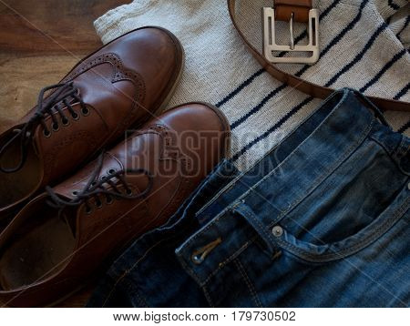 everyday clothing of a modern man: jeans , boots and a sweater