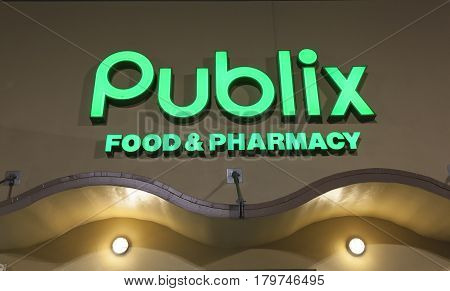 Miami FL USA - March 12 2017: Publix food and pharmacy grocery store sign illuminated at night. Miami Florida United States