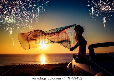 Silhouette Of Young Woman Relaxing At The Beach