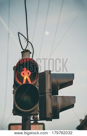 Red traffic light for pedestrians. Retro filtered