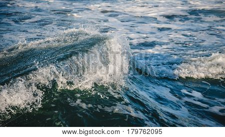 Close-up of a beautiful wave. Wave splash details abstract background